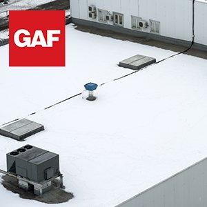 White and flat commercial roof with the GAF logo on the top left