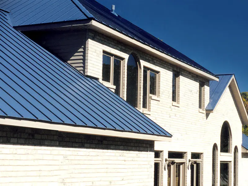 Home with a blue metal roofing